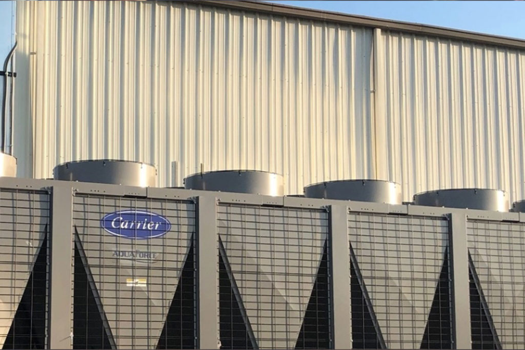 large Carrier air conditioning unit on industrial rooftop